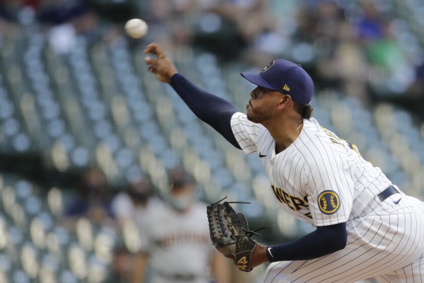 Milwaukee Brewers' Freddy Peralta pitches during the first inning of the team's baseball game against the Arizona Diamondbacks on Friday, June 4, 2021, in Milwaukee. (AP Photo/Aaron Gash)