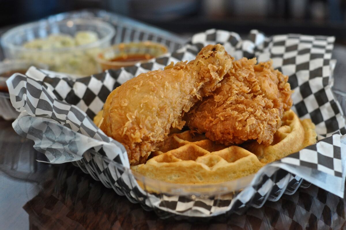 A combo order at Mabel's in downtown L.A. comes with two pieces of fried chicken, a waffle, one side, a syrup, a dipping sauce for the chicken and a drink.
