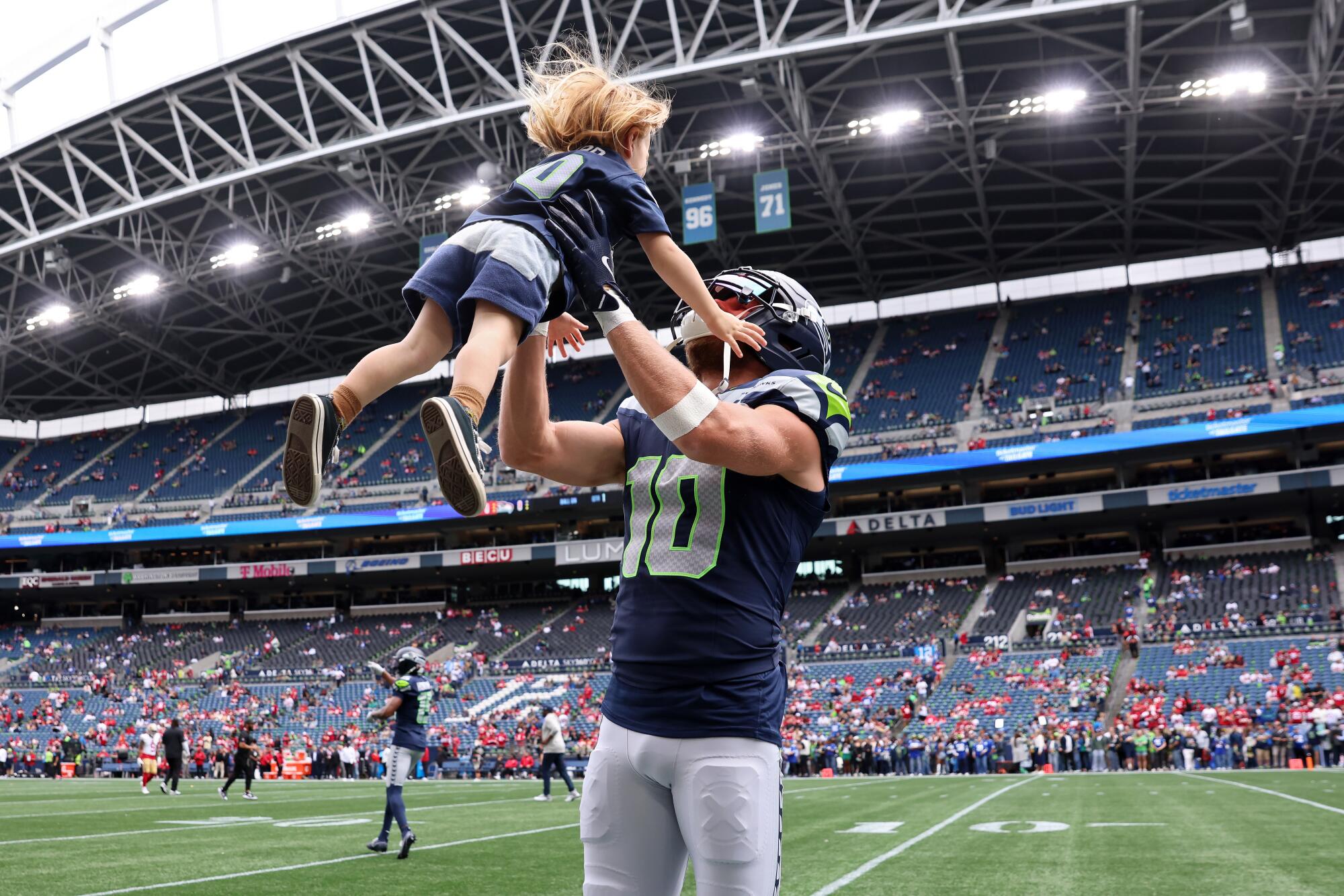 From Rams star to Seahawks mentor, Cooper Kupp readies for emotional L.A. return 4 Seahawks wide receiver Cooper Kupp spends a moment with one of his sons before a game.