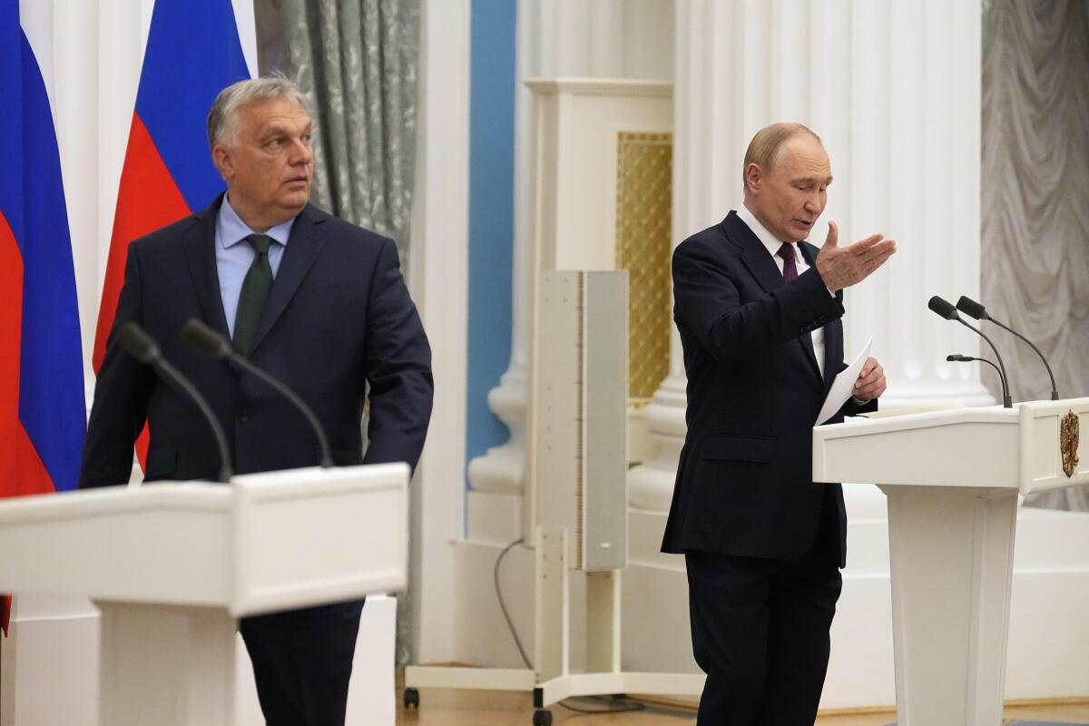 Russian President Vladimir Putin and Hungarian Prime Minister Viktor Orbán attend a joint news conference.