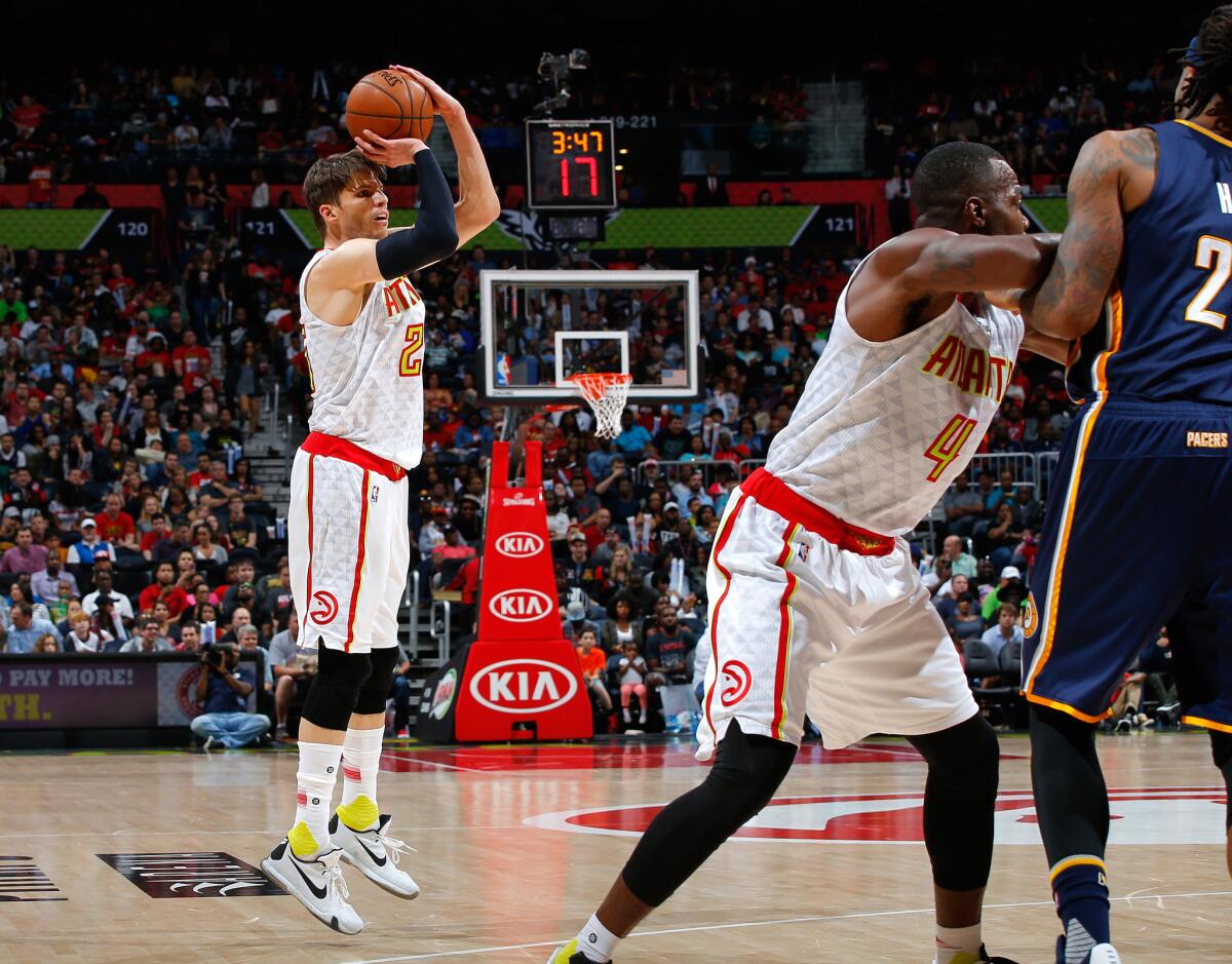 Hawks guard Kyle Korver (26) shoots a three-point basket against the Pacers.