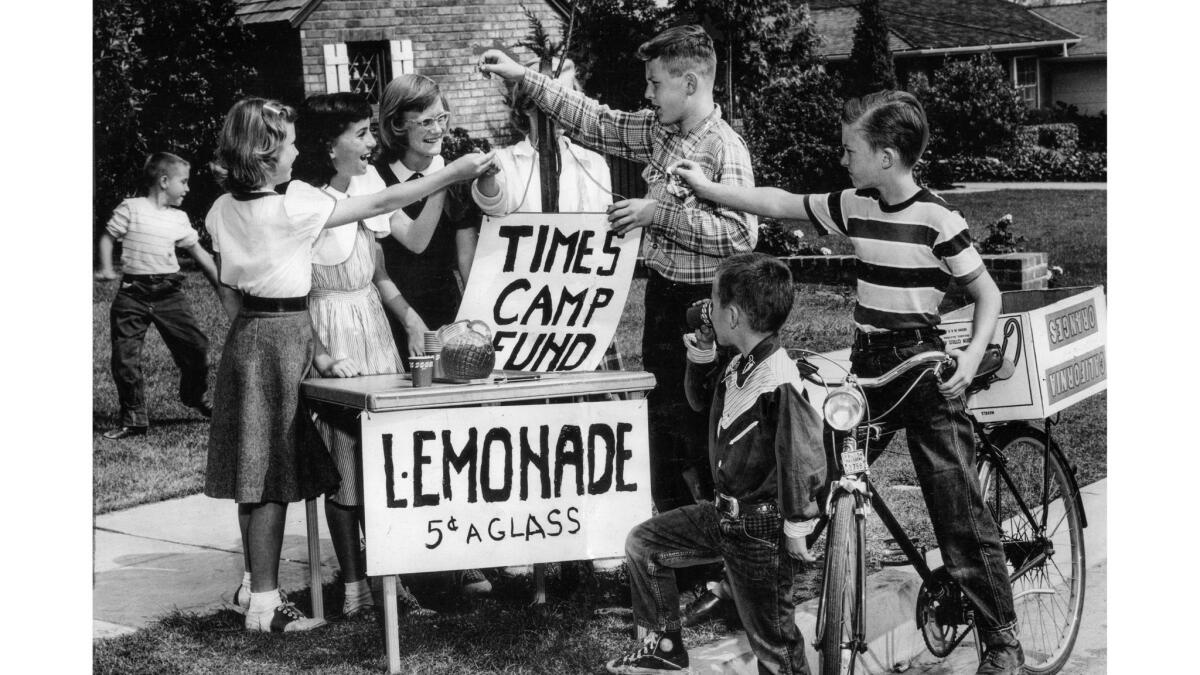 May 20, 1954: Wendy Earl, left, and Barbara Zeman, both 11, set up lemonade stand and raised $6.55 for the Los Angeles Times Summer Camp Fund.