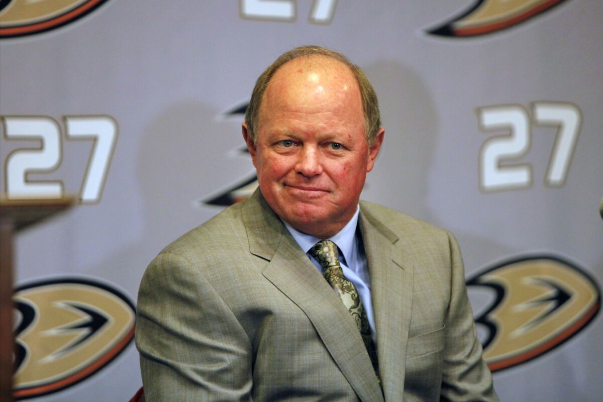 FILE - Anaheim Ducks executive vice president and general manager Bob Murray listens during an NHL hockey news conference at the Honda Center in Anaheim, Calif., on June 22, 2010. The Ducks have placed Murray on leave Tuesday, Nov. 9, 2021, amid an ongoing investigation into his conduct. The team did not specify the behavior Murray is accused of. (AP Photo/Damian Dovarganes, File)