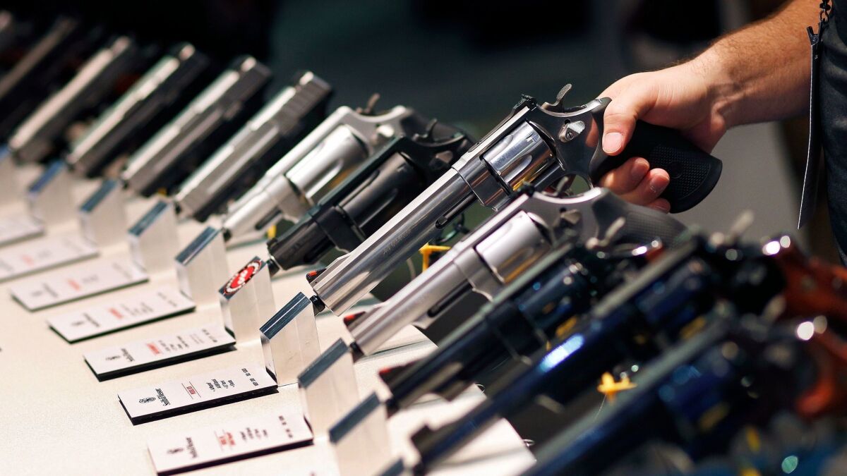 Handguns are displayed at the Hunting and Outdoor Trade Show in Las Vegas in 2016.