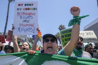 Venice, CA - July 04: Demonstrators take part in a July 4 National Day of Protest: "WHEN WOMEN ARE NOT FREE, NO ONE IS FREE!," Monday, July 4, 2022 in Venice, CA.(Ringo Chiu / For The Times)