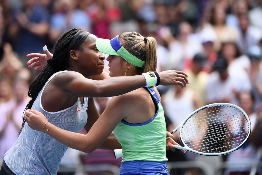 MELBOURNE, AUSTRALIA - JANUARY 26: Coco Gauff of the United States (L) hugs Sofia Kenin of the United States at the net following their Women's Singles fourth round match on day seven of the 2020 Australian Open at Melbourne Park on January 26, 2020 in Melbourne, Australia. (Photo by Quinn Rooney/Getty Images)