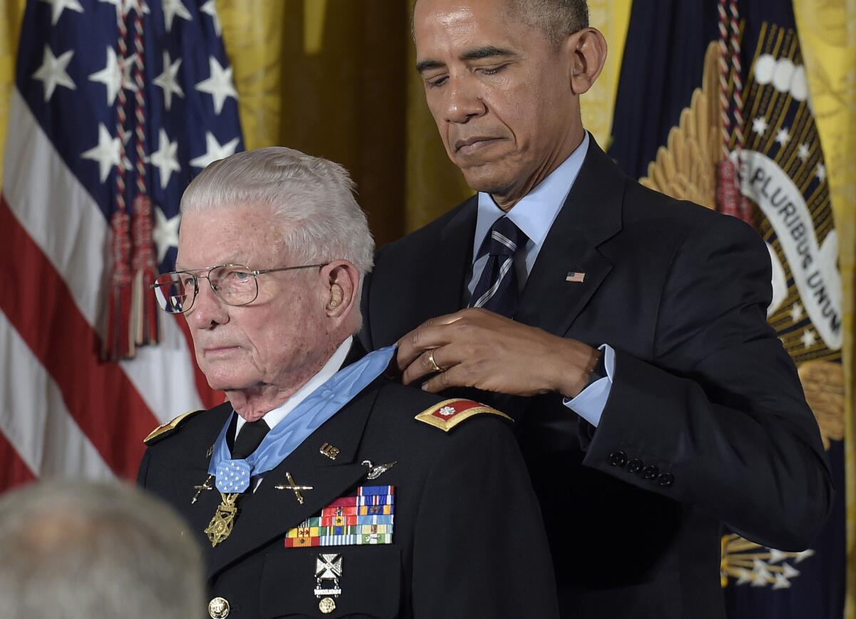 President Obama presents the Medal of Honor to retired Army Lt. Col. Charles Kettles of Michigan during a ceremony in the East Room of the White House in Washington on Monday.