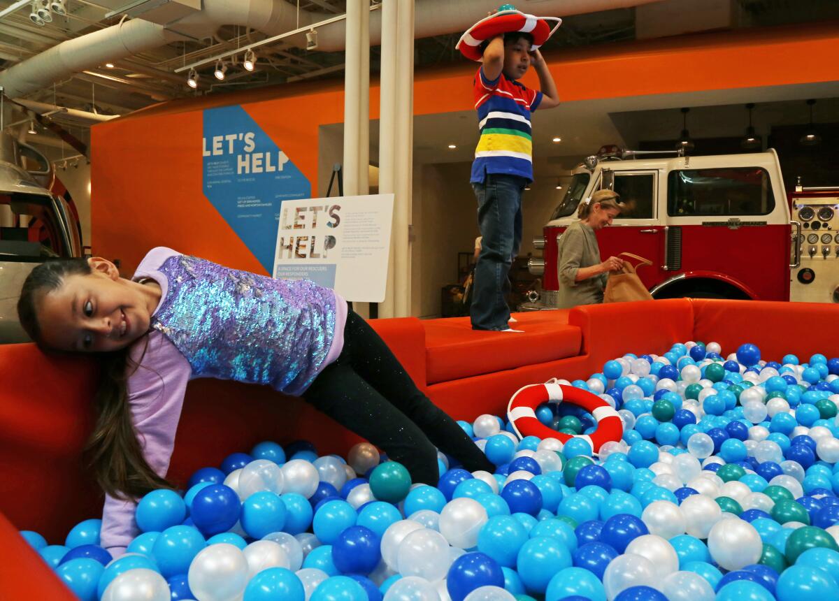 Hayley Alvarez, 7, and Nicholas Valladares, 6, play together in the ball pit at Cayton Children's Museum by ShareWell in Santa Monica.