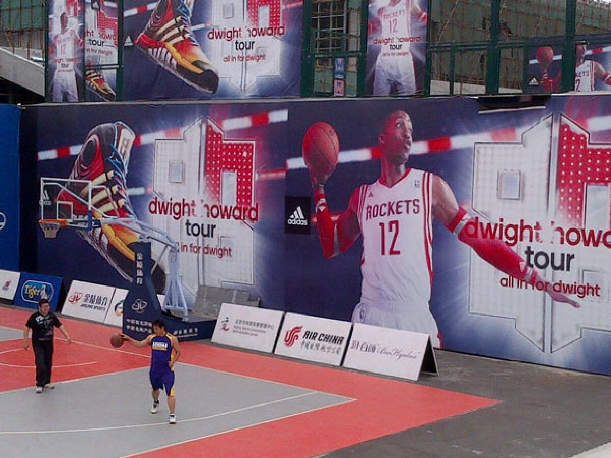 This Dwight Howard mural in China is in front of the arena the Lakers have been using to practice for an exhibition game Tuesday.