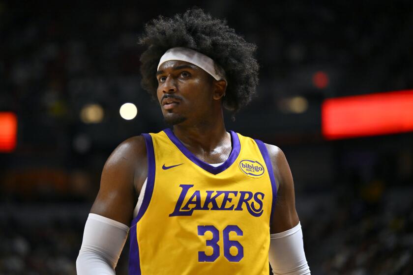 Los Aneles Lakers' Blake Hinson looks on during the first half of an NBA summer league basketball game against the Houston Rockets Friday, July 12, 2024, in Las Vegas. (AP Photo/David Becker)