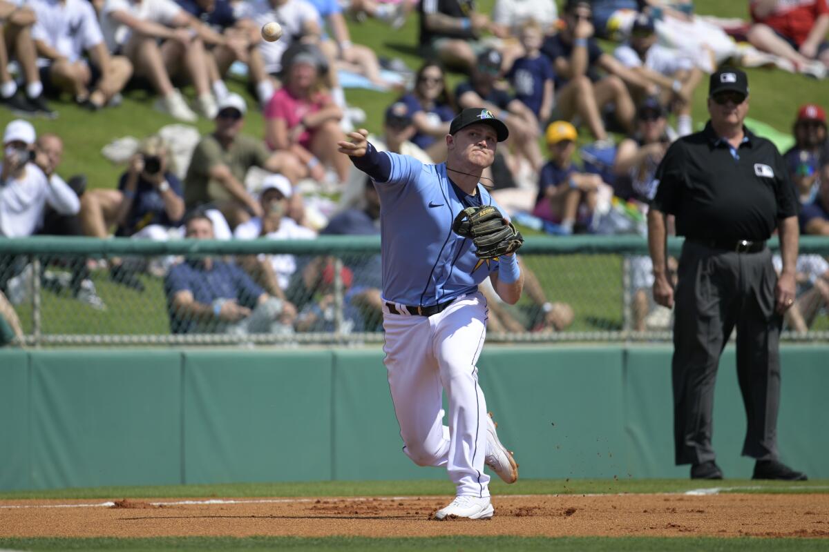 Rays third baseman Curis Mead throws to first base during spring training on Feb. 28.