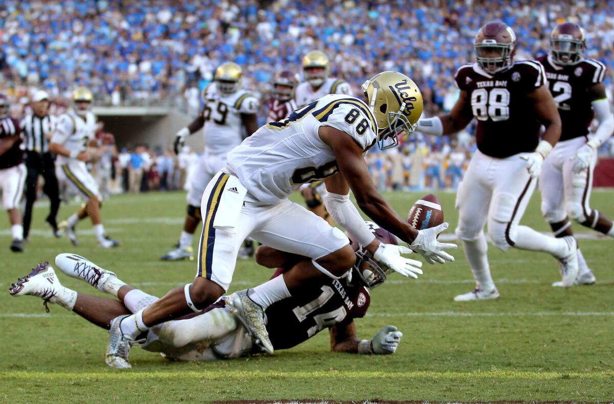 UCLA tight end Austin Roberts bobbles a potential touchdown pass at the goal line during the Bruins' overtime loss to Texas A&M a year ago.