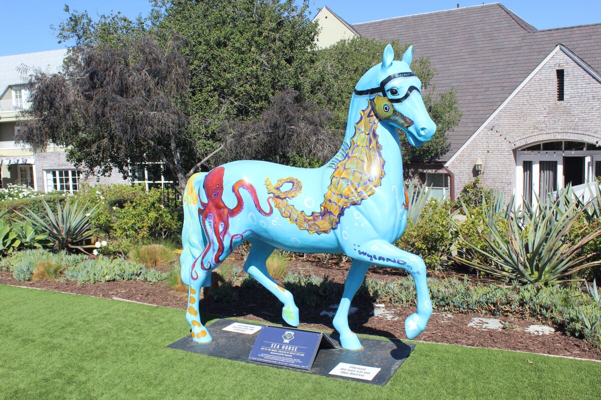 A painted horse in front of L'Auberge Del Mar.