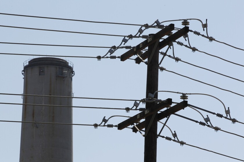 Power lines and the 400 foot smokestack tower of the Encina Power Station