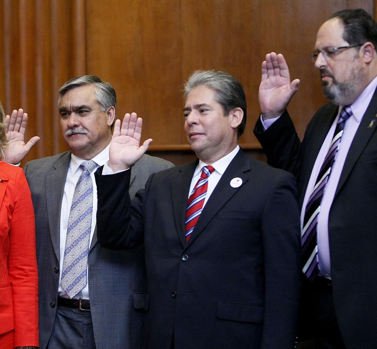 From left, Burbank City Council members Jess Talamantes, Bob Frutos and David Gordon are sworn into office, in this file photo taken on Wednesday, May 1, 2013. The trio are running for reelection and are facing five challengers.