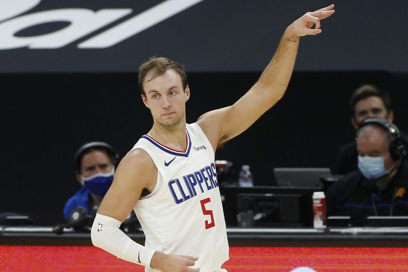 Clippers guard Luke Kennard gestures after making a three-point shot against the Suns on Jan. 3, 2021, in Phoenix.