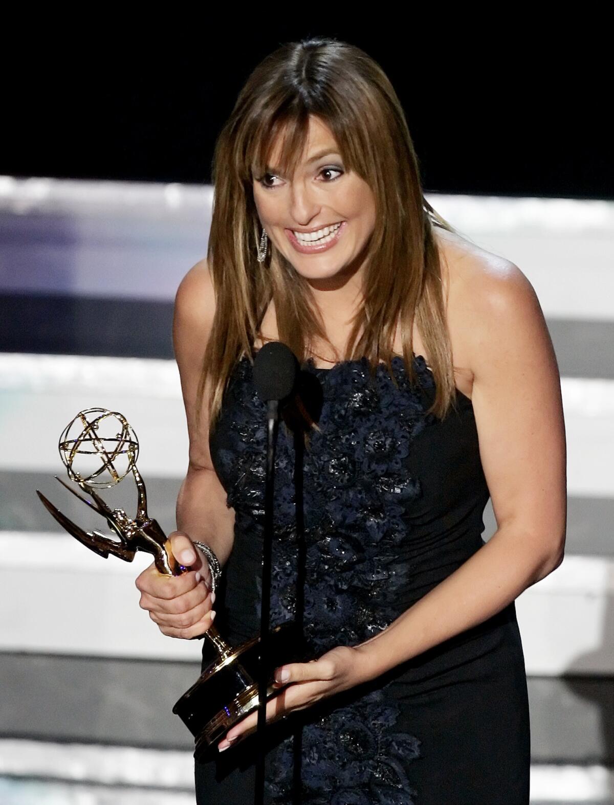 Mariska Hargitay accepts the award for lead actress in a drama series for her work on "Law & Order: Special Victims Unit" at the 58th Primetime Emmy Awards in 2006.