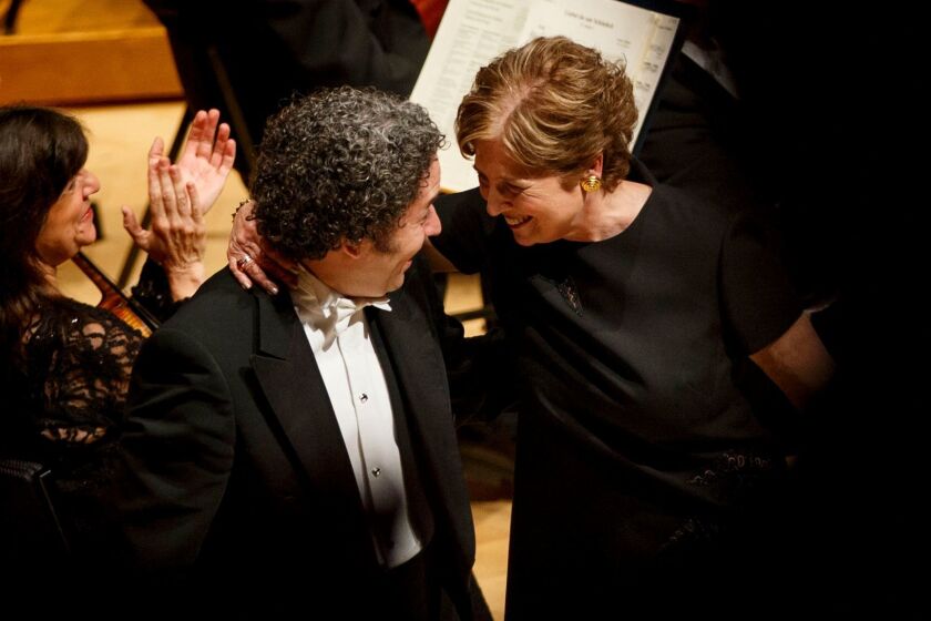 Outgoing LA Phil president Deborah Borda and conductor Gustavo Dudamel share a moment as she is honored during the LA Philharmonic performance at the Walt Disney Concert Hall on Thursday, May 18, 2017 in Los Angeles, Calif. The evening's performance featured Gustavo Dudamel's Schubert symphony as well as a tribute to outgoing president Deborah Borda, followed by a solo vocal from mezzo-soprano Sasha Cooke. (Patrick T. Fallon/ For The Los Angeles Times)