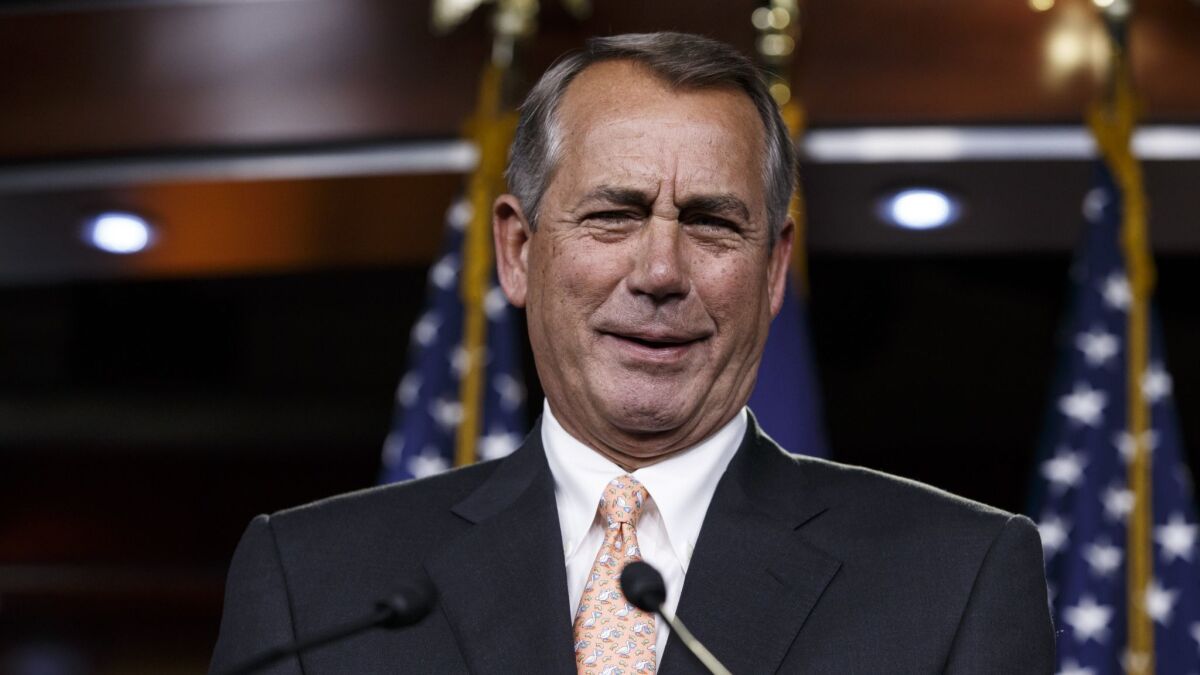 Former speaker of the House John Boehner, R-Ohio, responds to reporters at the Capitol in Washington, Thursday, Feb. 26, 2015.