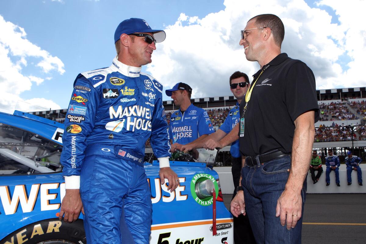 The future of Michael Waltrip Racing and MWR driver Clint Bowyer, left, is up in the air after the team's co-owner Rob Kauffman, right, announced he is buying a stake in a rival team.