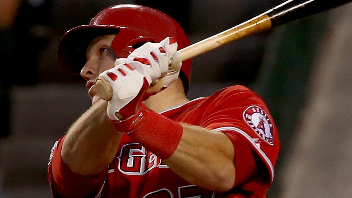 Angels center fielder Mike Trout hits a two-run home run in the second inning of the team's 8-6 win over the Minnesota Twins on Tuesday night.
