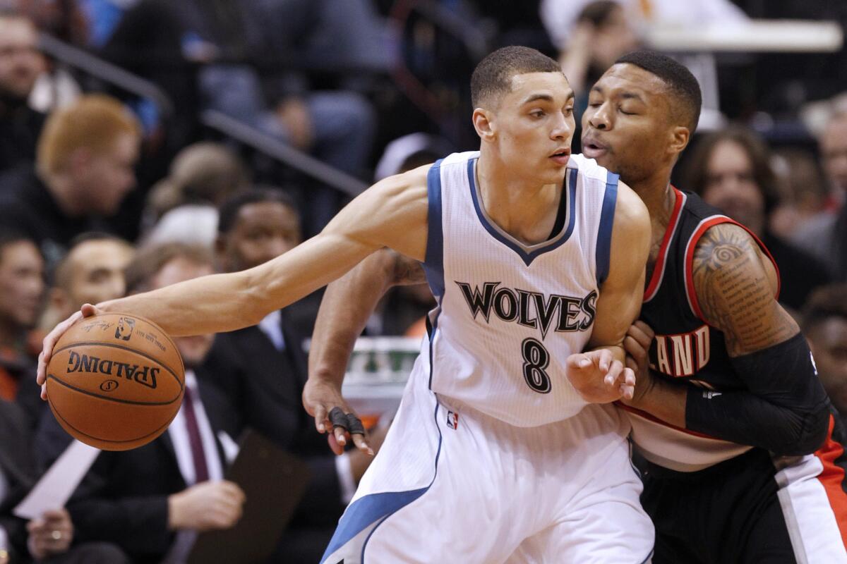 Minnesota guard Zach LaVine drives against Portland Trail Blazers guard Damian Lillard during the first quarter of a game Dec. 10.