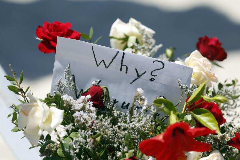 Flowers mark the scene the morning after a mass shooting in Sousse, Tunisia.