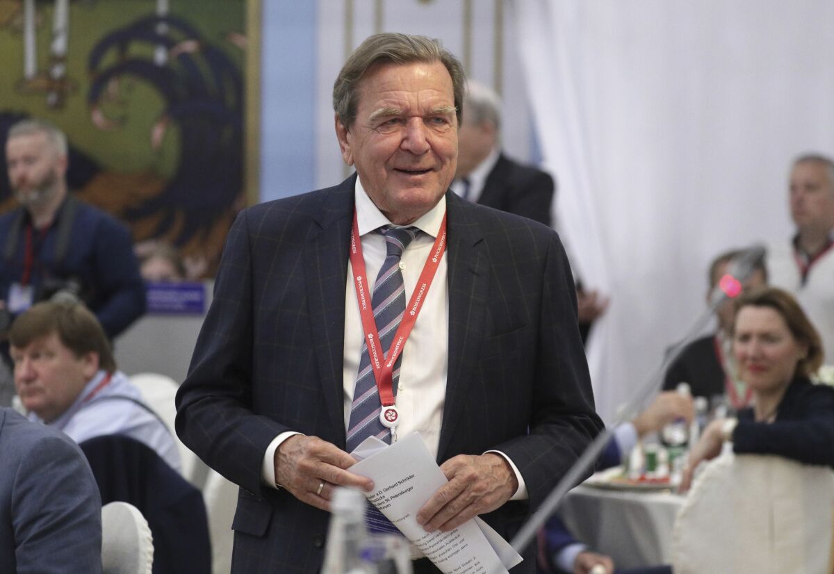 FILE - Former German Chancellor Gerhard Schroeder arrives to attend the St. Petersburg International Economic Forum in St. Petersburg, Russia, June 7, 2019. German Chancellor Olaf Scholz has on Thursday, March 3, 2022 asked former Chancellor Gerhard Schroeder to resign from his posts at Russian state-owned companies. Schroeder is a longtime friend of Russian President Vladimir Putin — a relationship that has led to much criticism in Germany, especially since Russia invaded Ukraine. (Vladimir Smirnov/Pool Photo via AP, file)