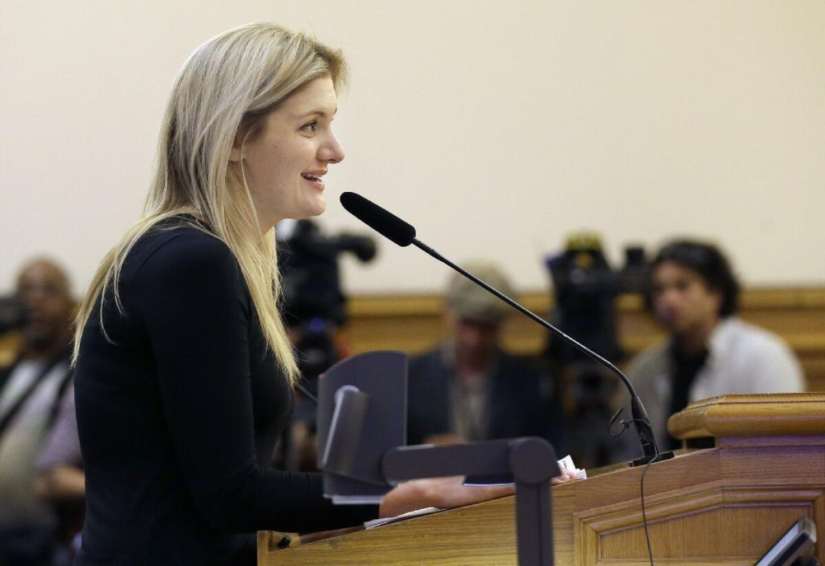 Google program manager Crystal Sholts speaks in favor of employee shuttles before the San Francisco Municipal Transportation Agency board of directors at City Hall in San Francisco on Tuesday. San Francisco officials voted in favor of a proposal to start regulating employee shuttles for companies such as Google, Facebook and Apple.