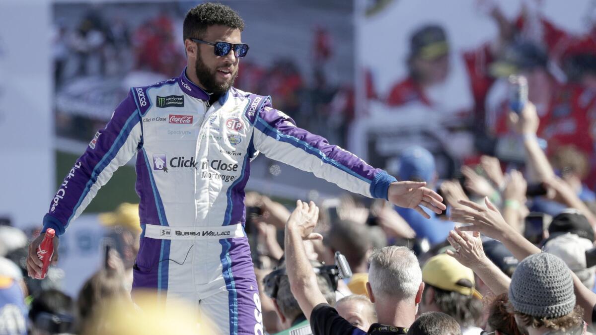 Bubba Wallace greets fans as he is introduced before the Daytona 500 on Feb. 18, 2018.
