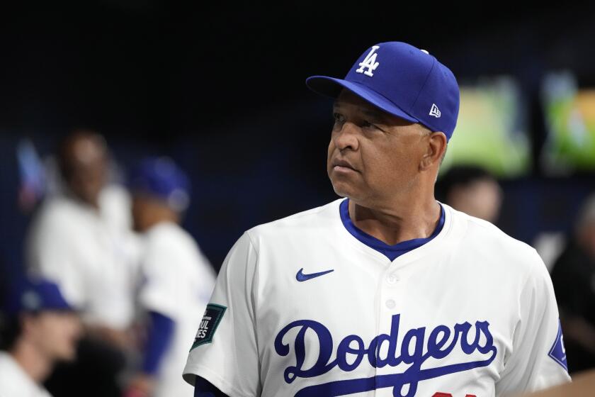 Los Angeles Dodgers manager Dave Roberts stands in the dugout prior to a baseball game against the San Diego Padres at the Gocheok Sky Dome in Seoul, South Korea Thursday, March 21, 2024, in Seoul, South Korea. (AP Photo/Lee Jin-man)