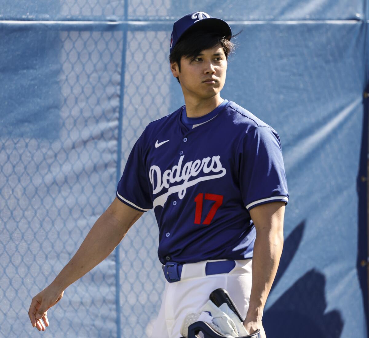 Dodgers' Shohei Ohtani walks around during the second day of spring training in Phoenix on Feb. 15, 2024.