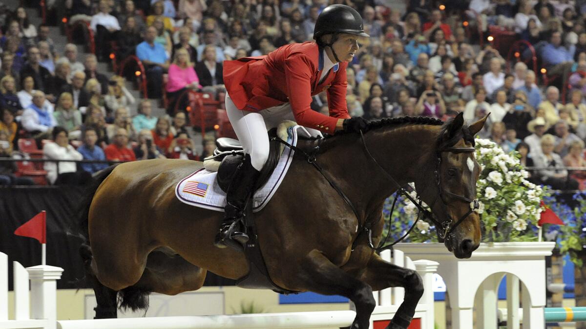 Elizabeth Madden of the U.S. rides her horse, Simon, to a second-place finish at the Longines FEI World Cup Jumping final II in Las Vegas on Friday.