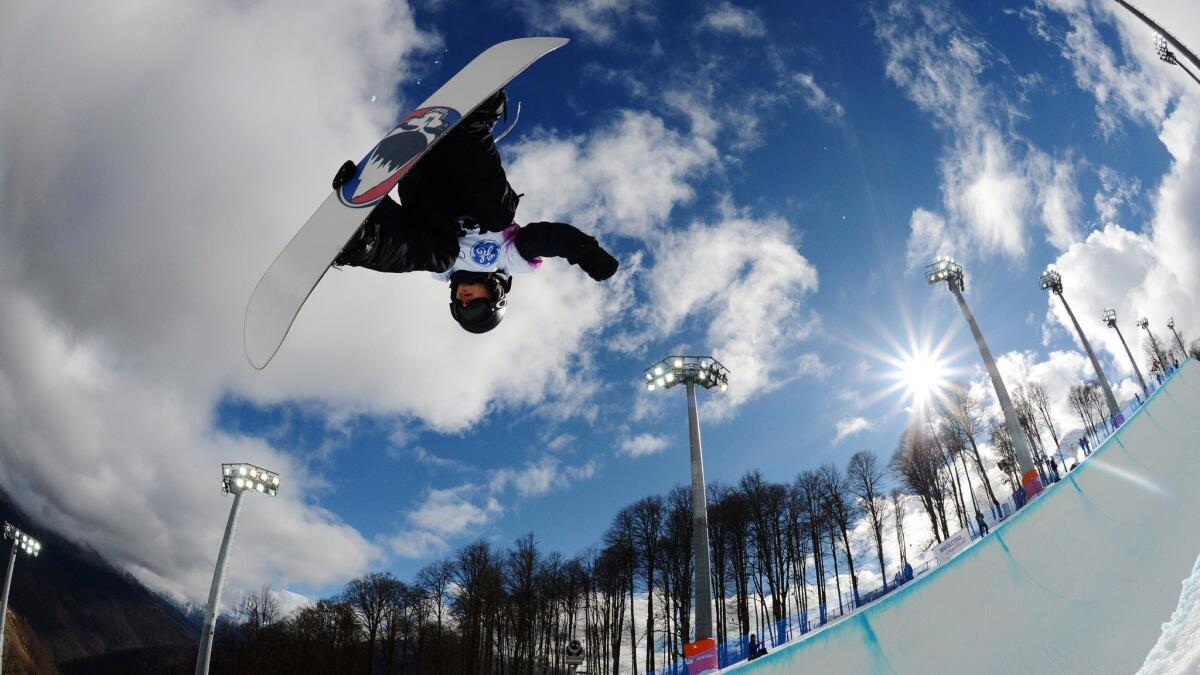 Russia's Dmitriy Koltsov competes at a halfpipe qualifying event for the Snowboard World Cup at the Snowboard and Freestyle Center in Sochi, Russia, in 2013.