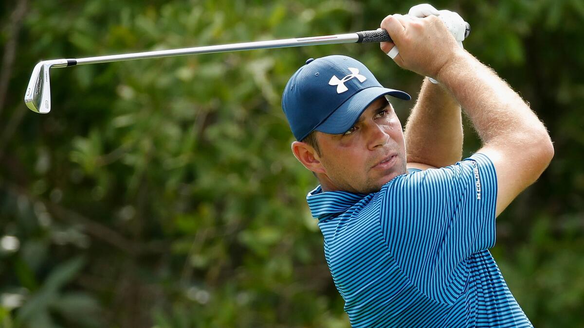 Gary Woodland watches his tee shot at No. 17 during the second roundof the OHL Classic at Mayakoba on Friday.