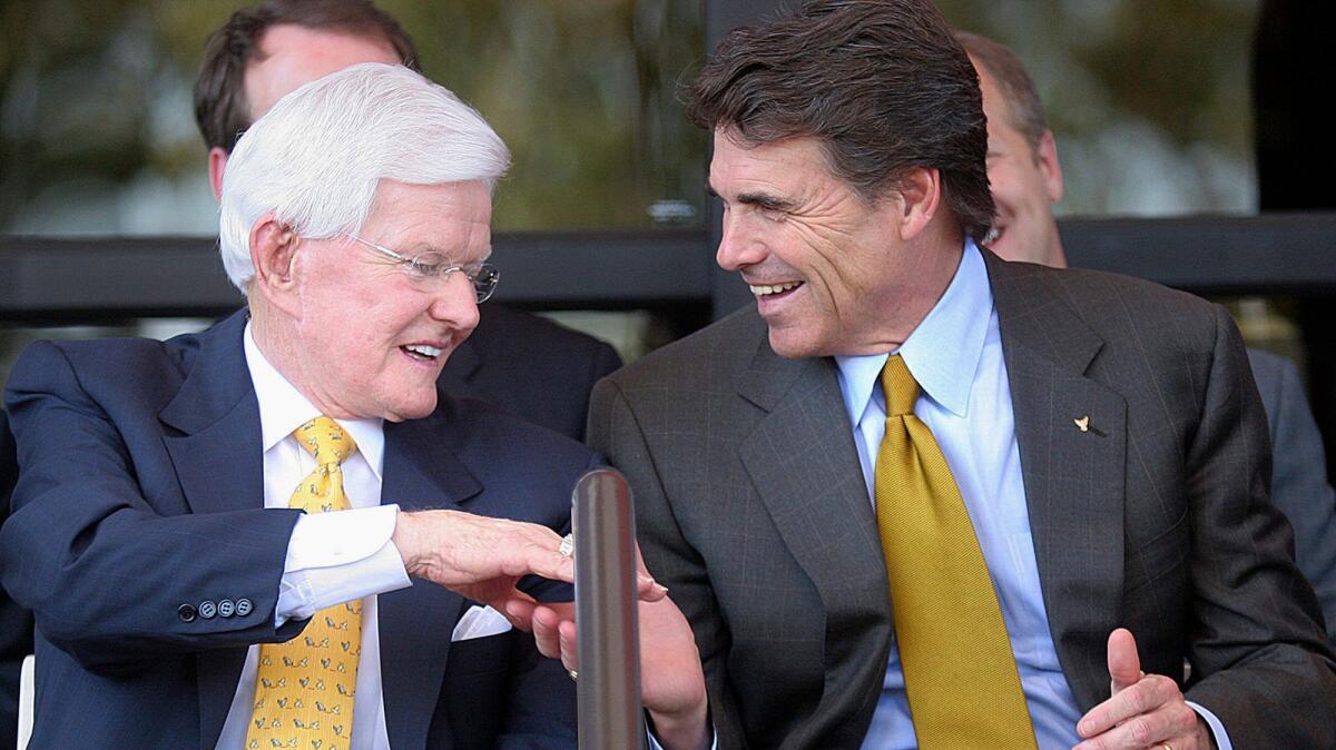 Lonnie "Bo" Pilgrim shakes hands with then-Texas Gov. Rick Perry at a dedication ceremony for Pilgrim's Pride Chicken's new headquarters on Sept. 18, 2005.