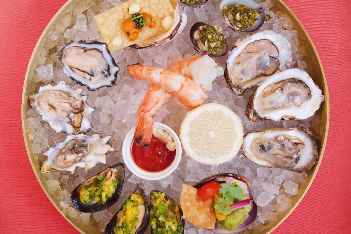 An overhead photo of an iced platter of oysters, shrimp, mussels and clams from the Lonely Oyster.