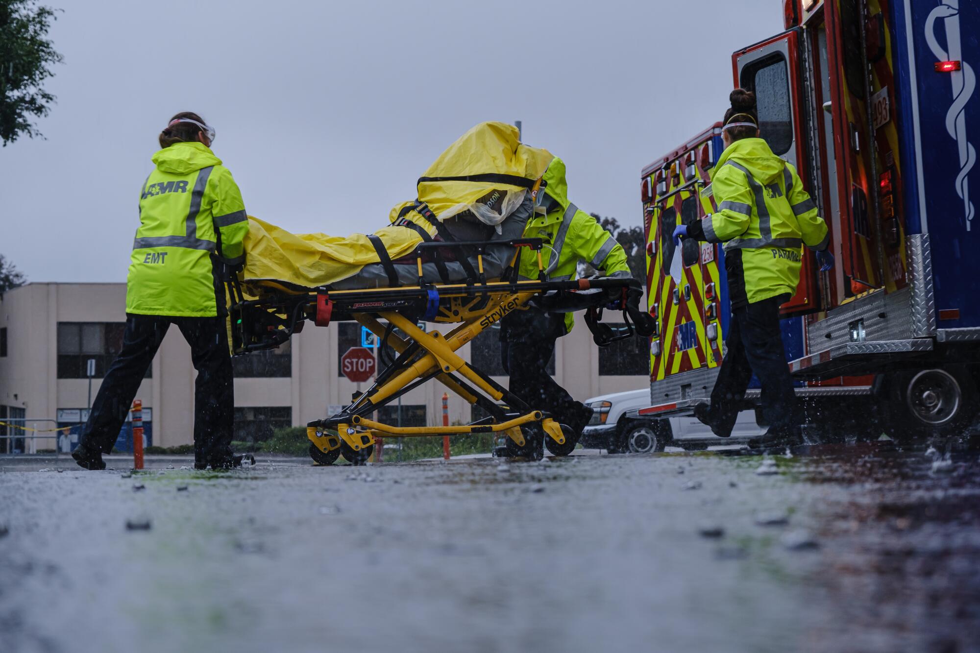 EMTs unload a patient