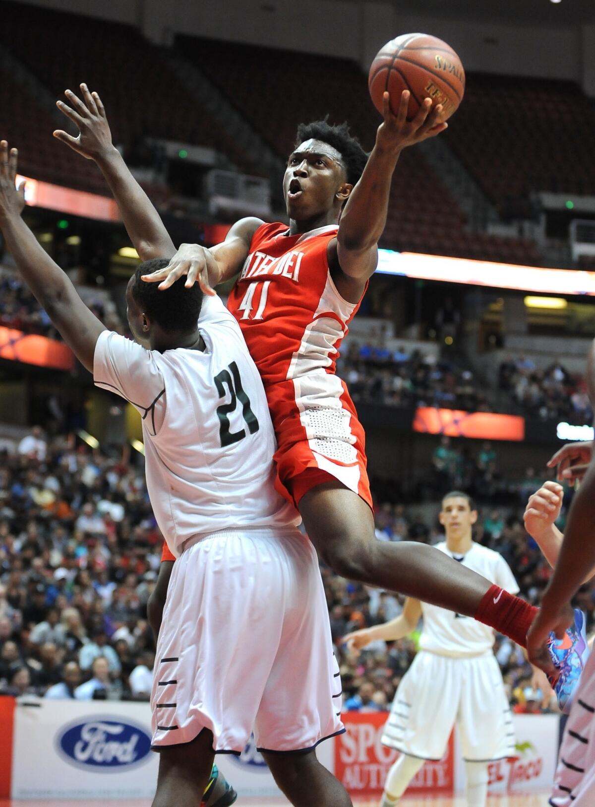 Mater Dei's Stanley Johnson, shown shooting over Chino Hills' Nnamdi Okongwu, scored the Monarchs' final eight points en route to a 48-44 victory Saturday in the Southern Section Open Division boys' basketball championship.