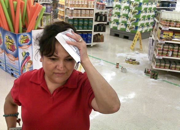 Rosa Ramos, an employee at Kmart in Diamond Bar, said she was hit on the head by an item falling off a shelf during the quake. The store stayed open immediately after the quake and customers tried to shop around the fallen items, but then management decided to close for cleanup. (An earlier version of this caption said the Kmart was in Chino Hills.)