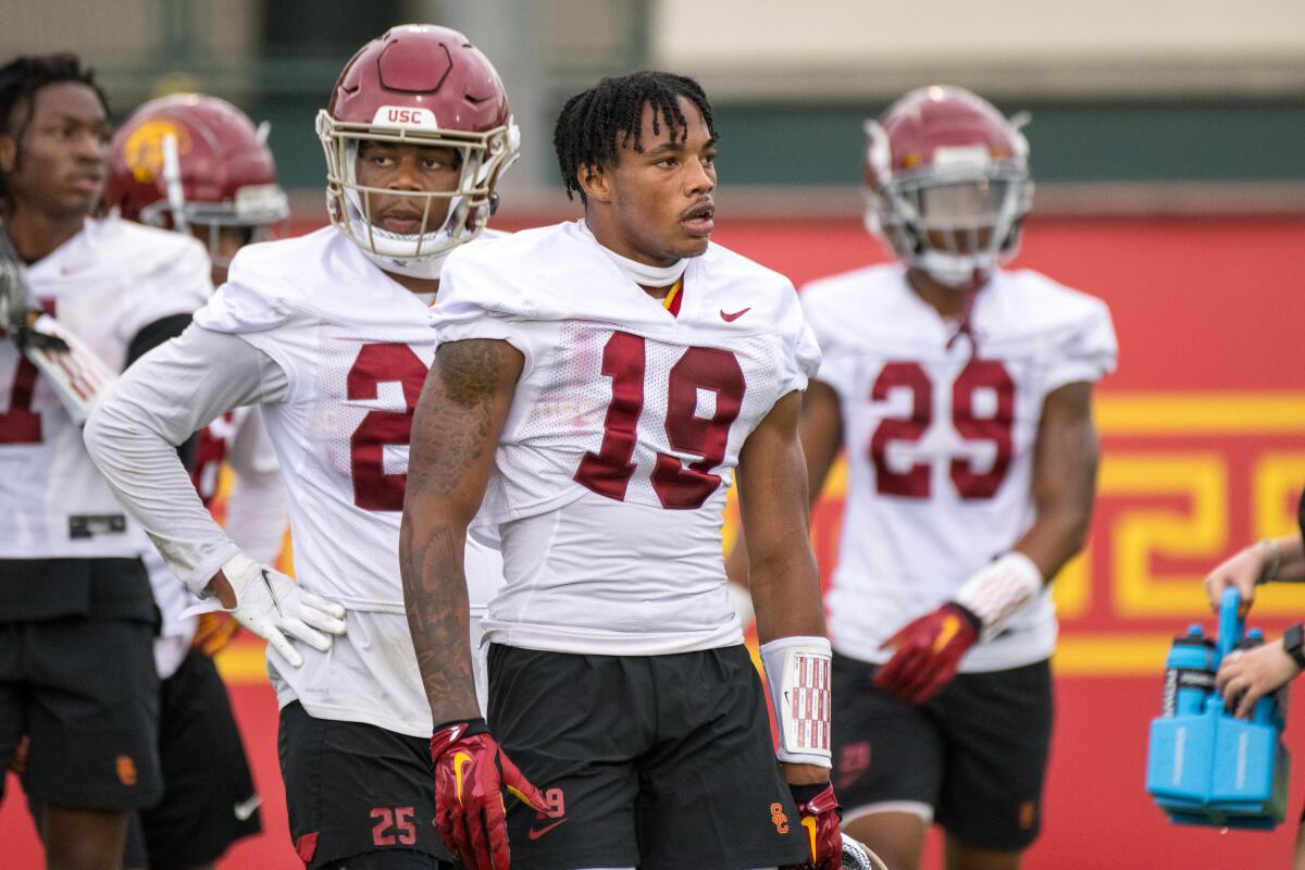 USC defensive back Jaylin Smith (19) and teammates at practice during the first day of fall training camp Aug. 5.