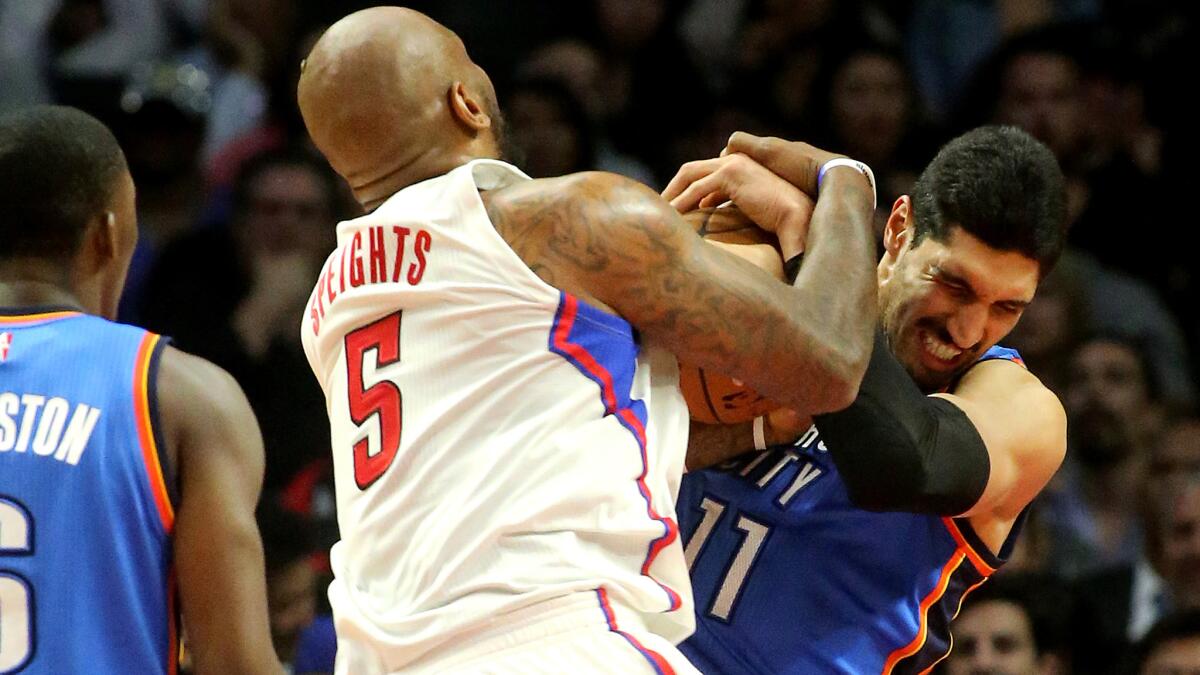 Clippers forward Marreese Speights fights for a rebound against Thunder center Enes Kanter during a Nov. 2 game at Staples Center.