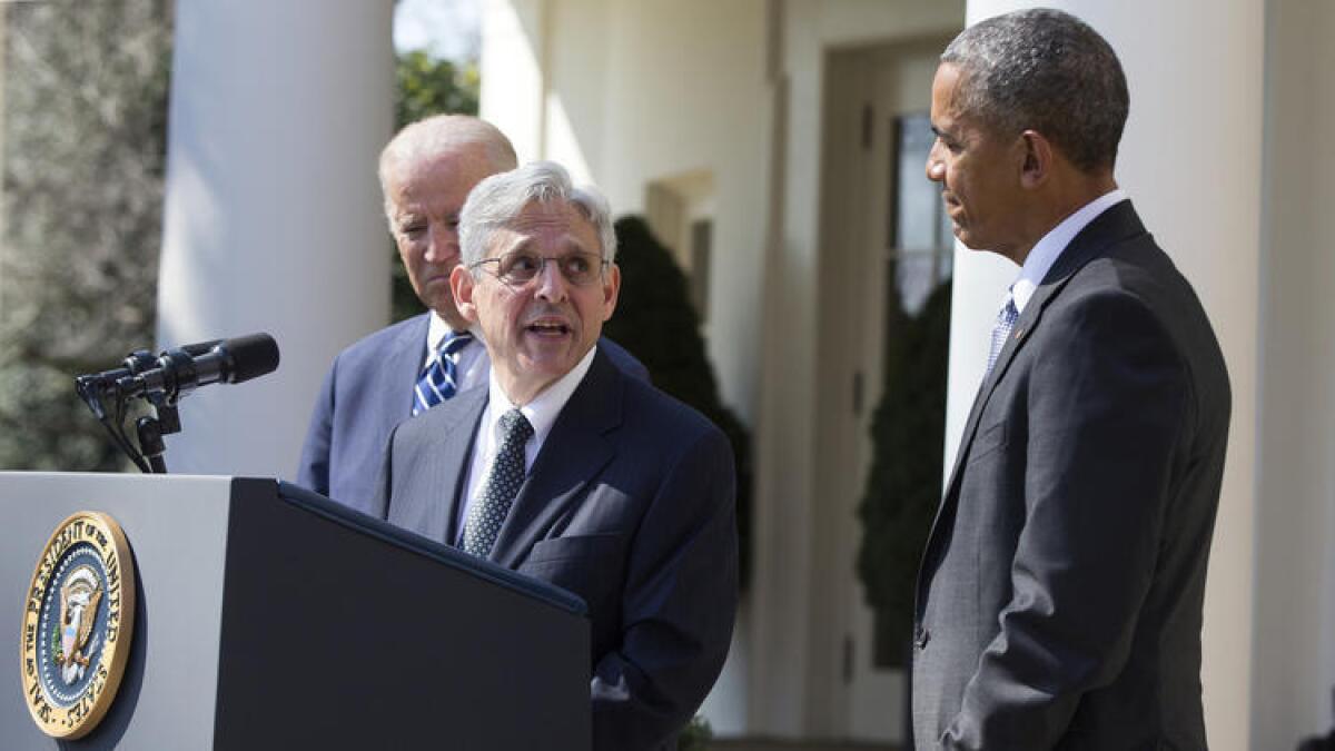 Supreme Court nominee Merrick Garland is flanked at the White House by Vice President Joe Biden and President Obama.