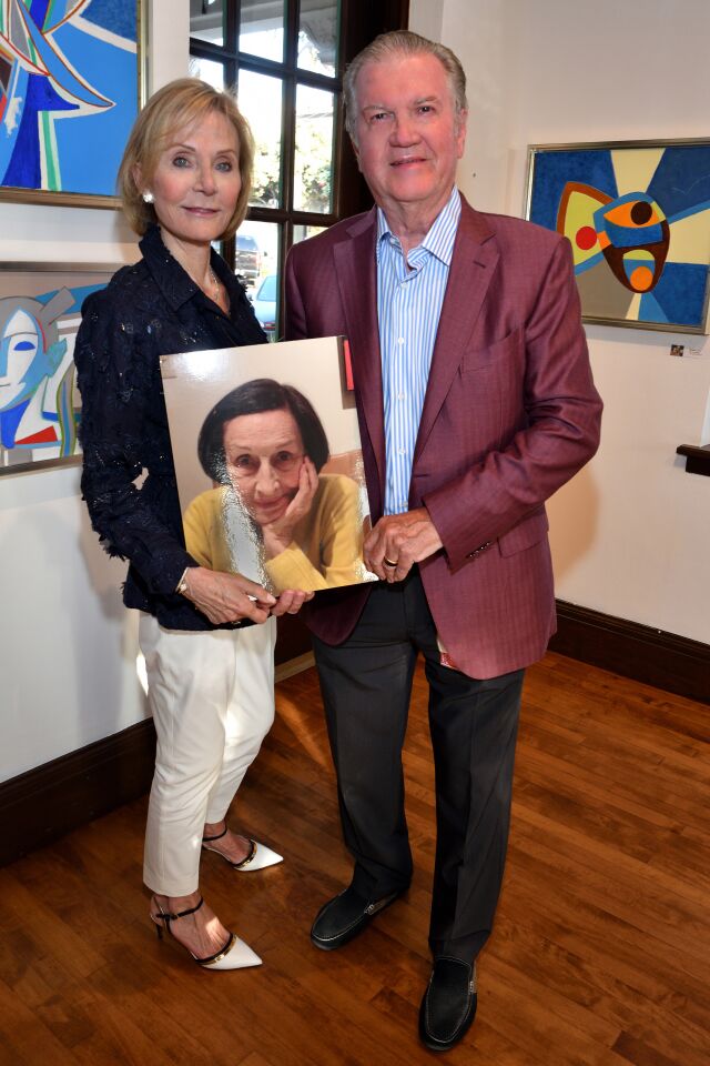 Lee Clark and Dr. Jerry Pikolycky hold a picture of Francoise Gilot.