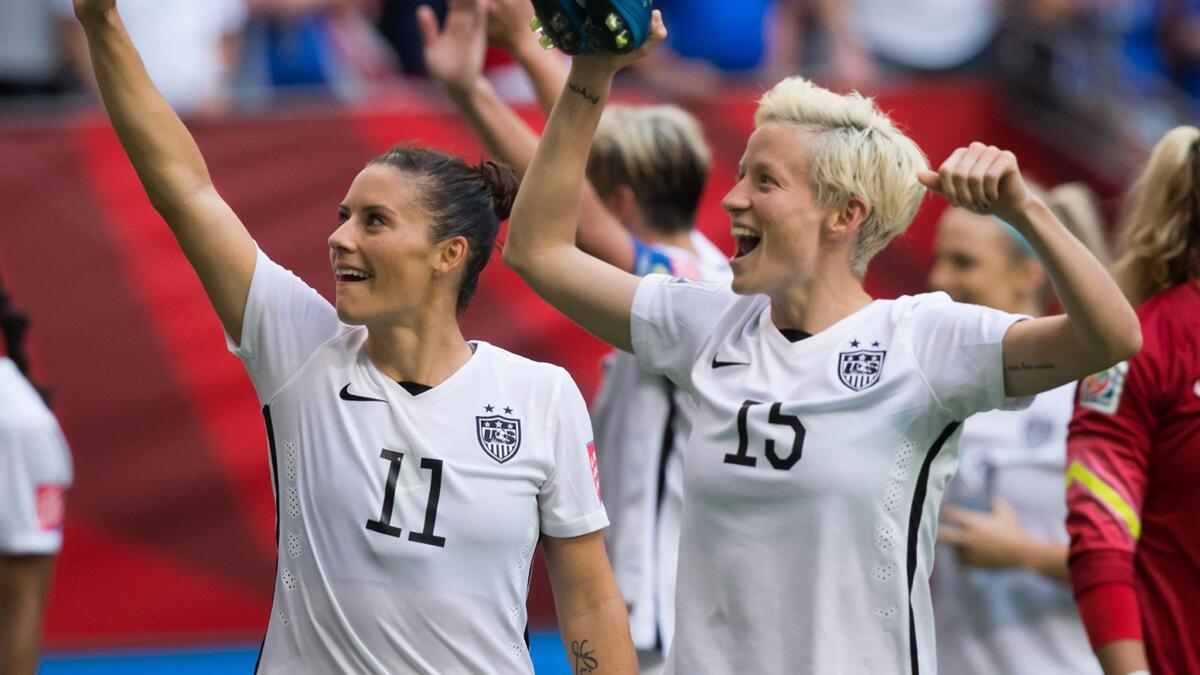 U.S. teammates Ali Krieger, left, and Megan Rapinoe celebrate the team's 1-0 victory over Nigeria at the World Cup in Vancouver, Canada, on Tuesday.