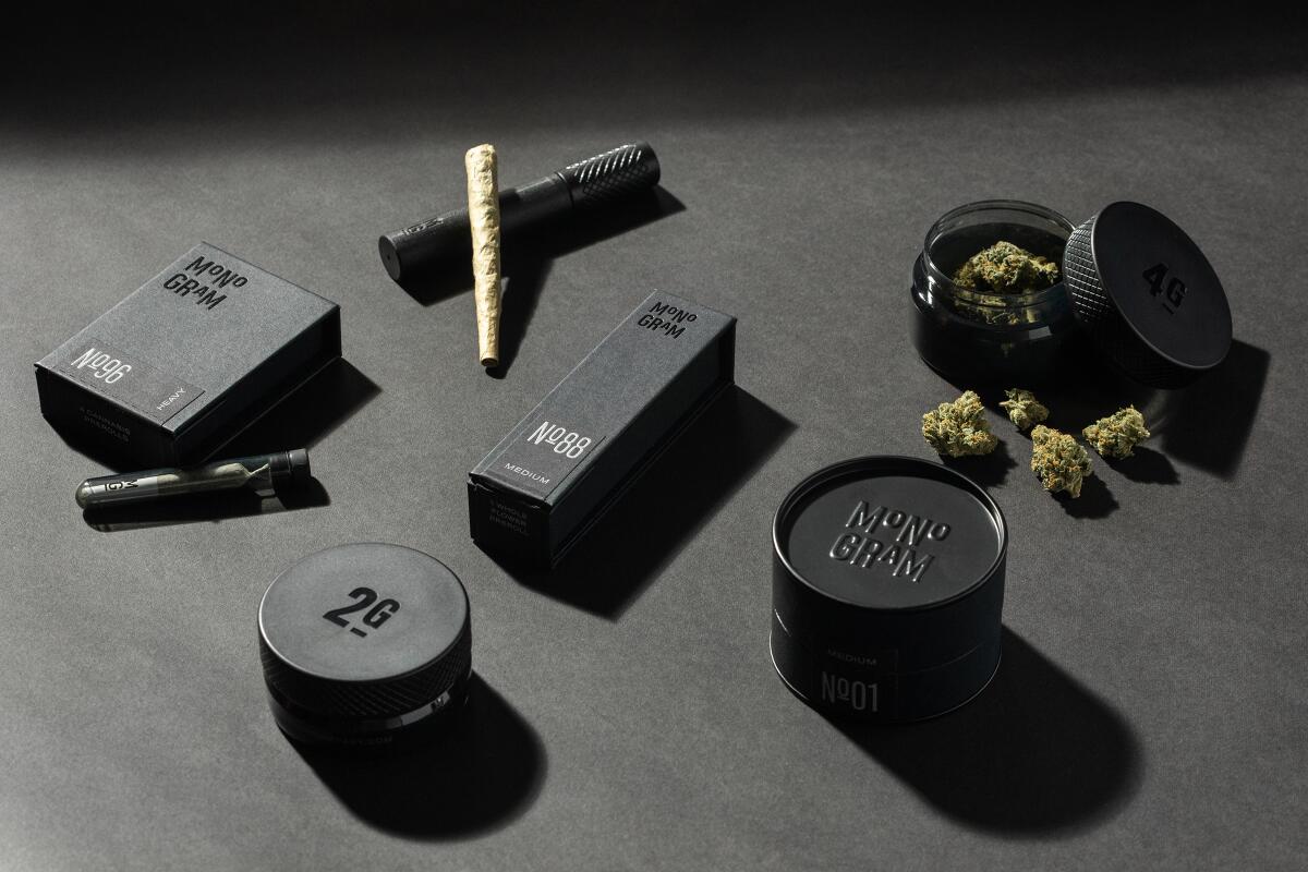 A display of three different Monogram cannabis products.