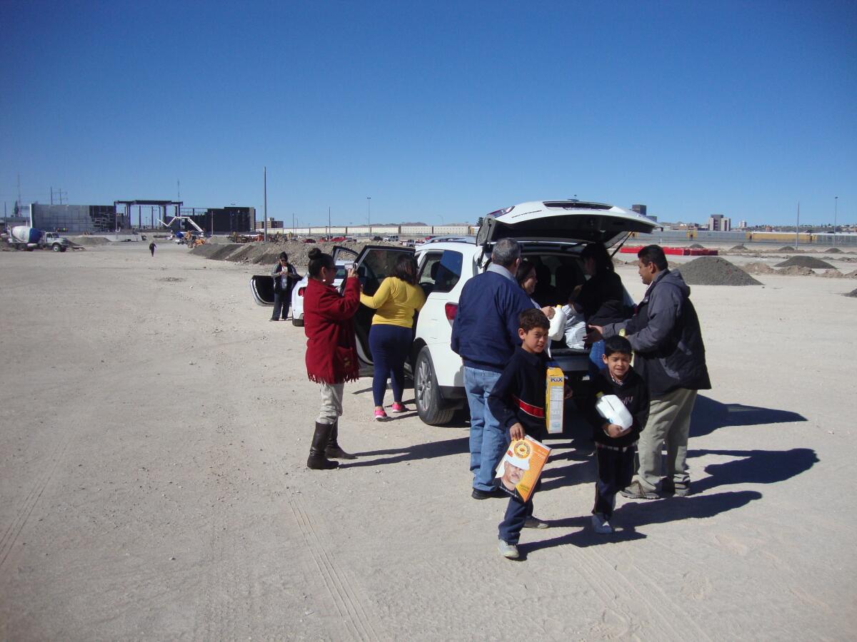 A group of volunteers from El Paso, Texas, brings supplies for an orphanage in Ciudad Juarez, Mexico. The El Paso residents will be among thousands of volunteers lining the route of Pope Francis when he visits Juarez on Wednesday.