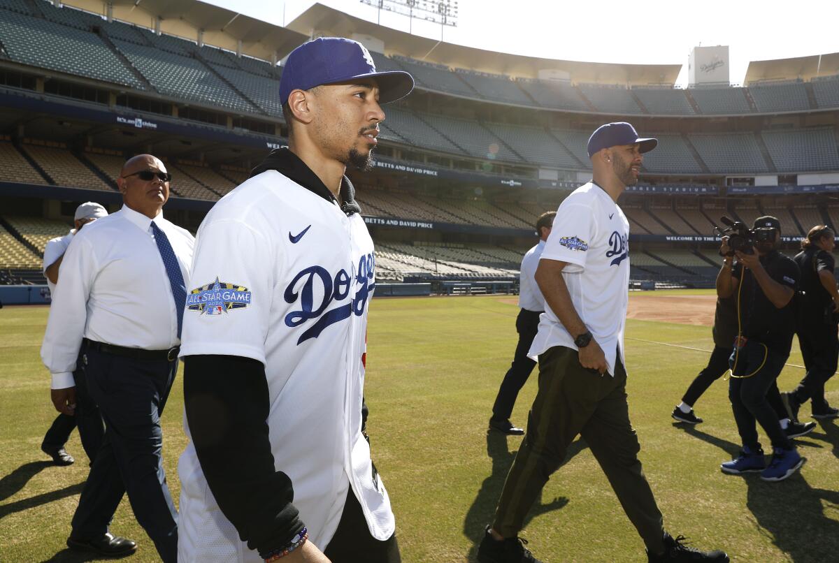 Mookie Betts, left, and David Price are introduced as the newest Dodgers at Dodger Stadium on Wednesday.