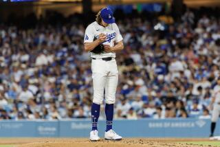 LOS ANGELES, CA - JULY 24, 2024: Los Angeles Dodgers pitcher Tyler Glasnow (31) clutches the ball tightly on the mound after giving up a homer to San Francisco Giants third base Matt Chapman (26) in the fourth inning at Dodgers Stadium on July 24, 2024 in Los Angeles, California.(Gina Ferazzi / Los Angeles Times)