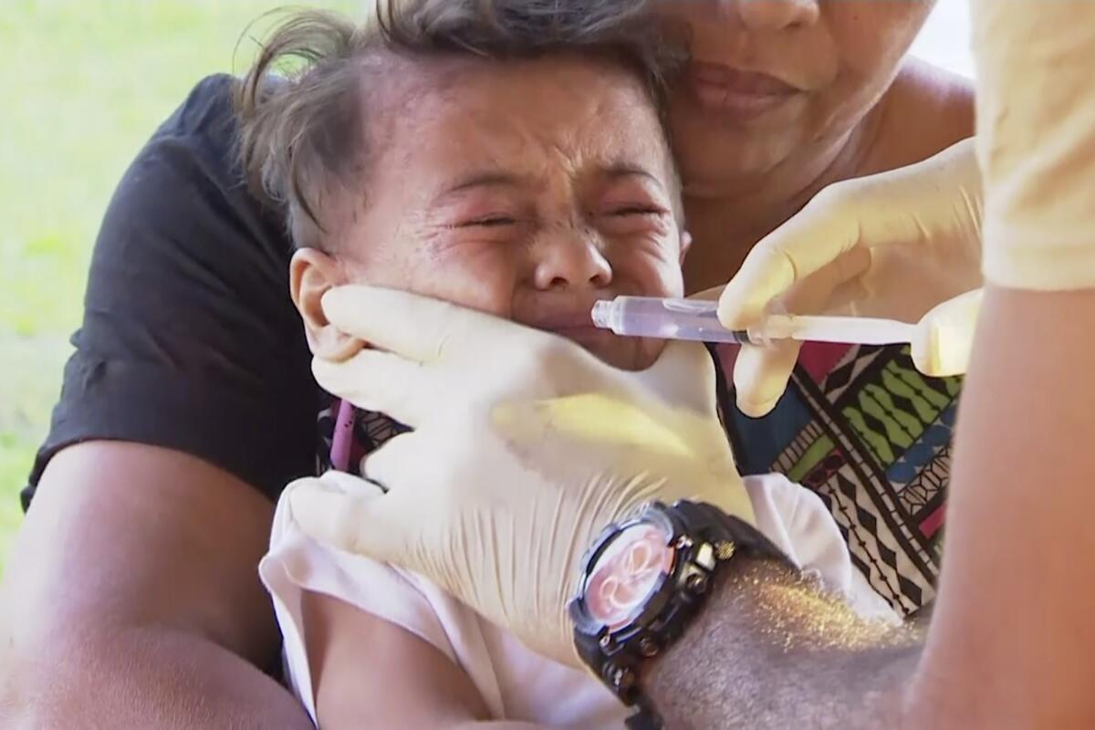 A child is vaccinated at a health clinic in Apia, Samoa, earlier this month.